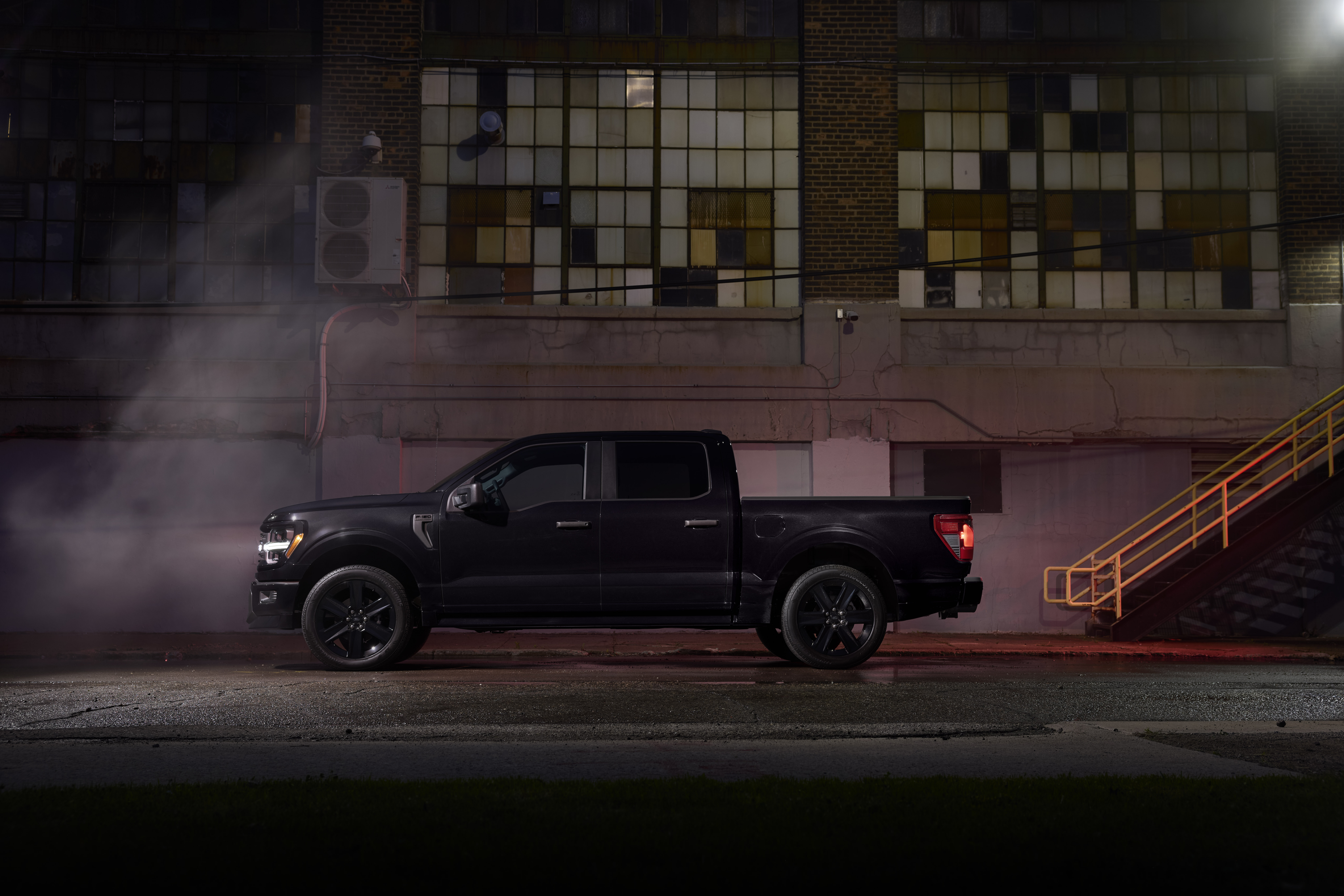 Side shot of Ford F-150 Lobo at night.